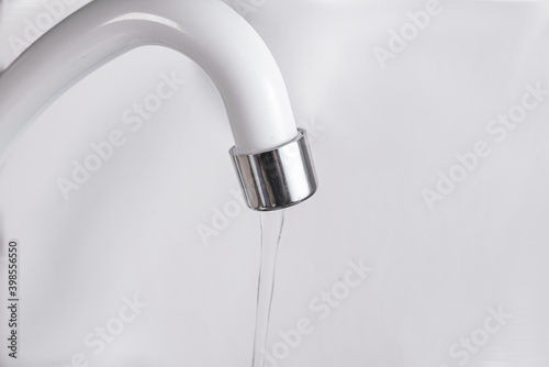 White kitchen sink faucet  - Close up