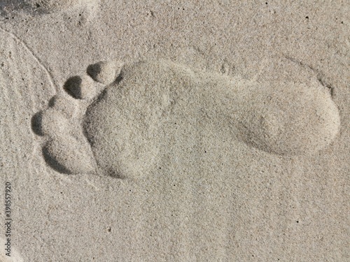 Footprints on the beach, sand.