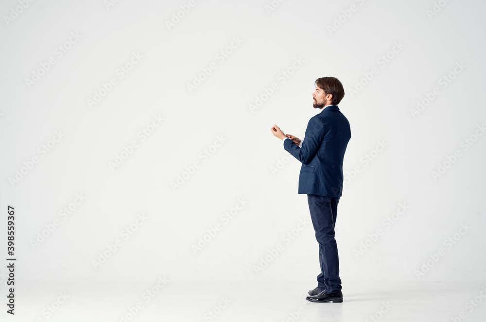 business man on a light background in a classic suit Copy Space back view business man on a light background in a classic suit Copy Space back view