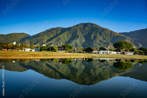 Panoramic view of a sunrise at Parque del Este with El Avila at the background