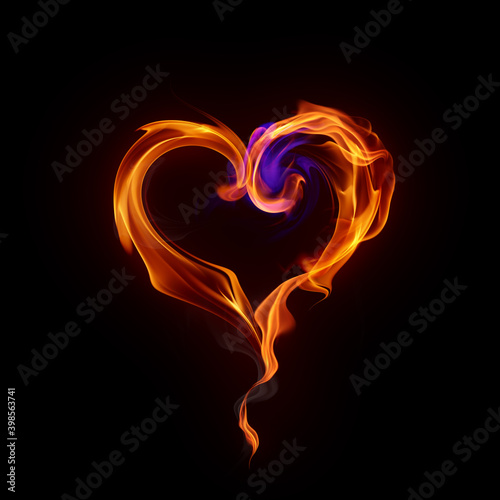 Burning heart symbol. Real fire flames and smoke isolated on black background. Valentine card.