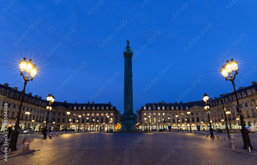 Vendome column with statue of Napoleon Bonaparte, on the Place Vendome at night, aris, France.
