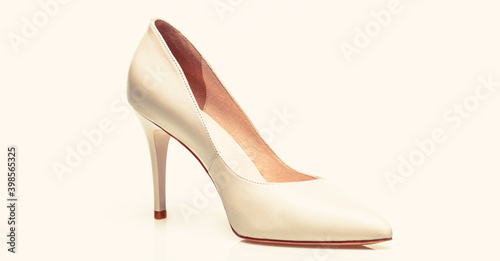Fashionable women shoes isolated on white background. White high heel women shoes on white background