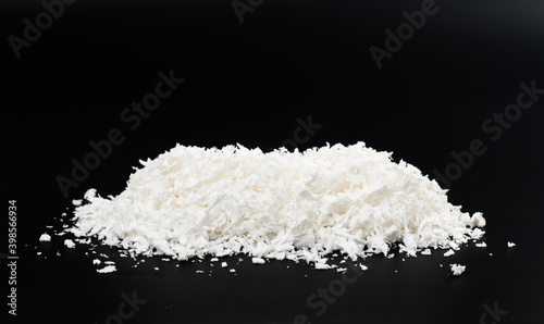 white artificial synthetic snow on black background