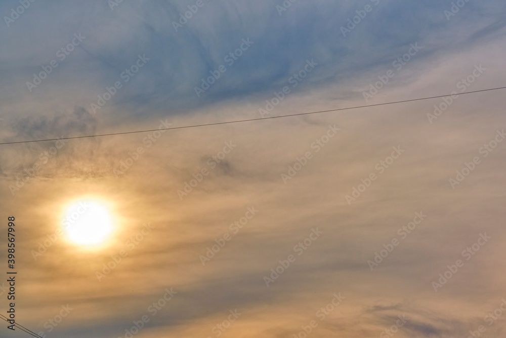 Sun illuminates feather clouds. general plan. day light Sun illuminates feather clouds. general plan. day light