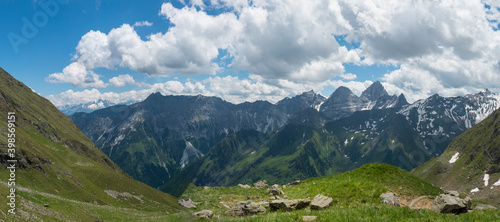 Panoramic view from Pramarnspitze saddle on snow-capped moutain panorama at Stubai hiking trail, Stubai Hohenweg, Alpine landscape of Tyrol Alps, Austria. Summer blue sky, white clouds © Kristyna