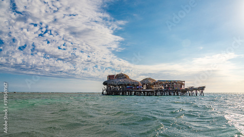 The famous Pelican Bar, at sunset with dramatic clouds on blue sky. Jamaica