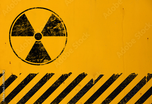 Murais de parede Black radioactive sign over yellow background