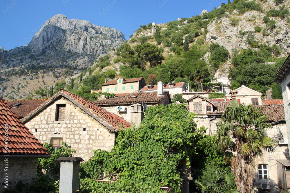 Roofs of old houses in Kotor, Montenegro with mountains in the background