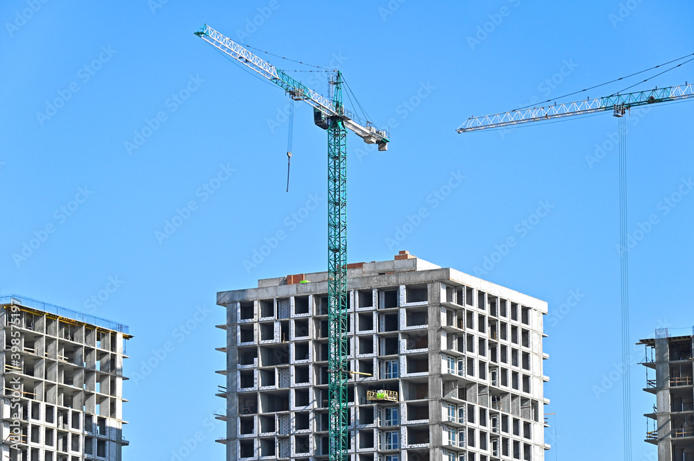 Crane and highrise construction site