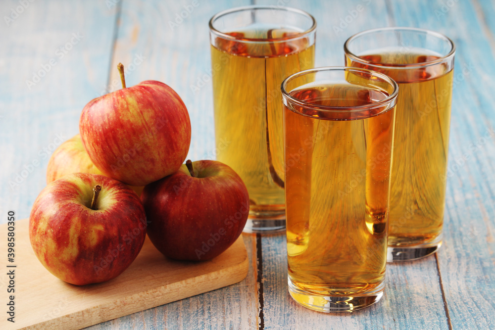 Three glasses with apple juice and ripe apples
Three glasses with apple juice and ripe apples