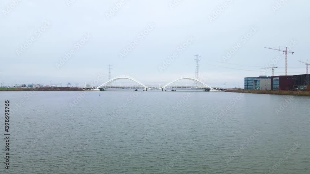 Aerial drone video of the Enneus Heermabrug in Amsterdam, The Netherlands going to Ijburg and Steigereiland Amsterdam Oost east. Aerial drone video of the Enneus Heermabrug in Amsterdam, The Netherlands going to Ijburg and Steigereiland Amsterdam Oost east.
