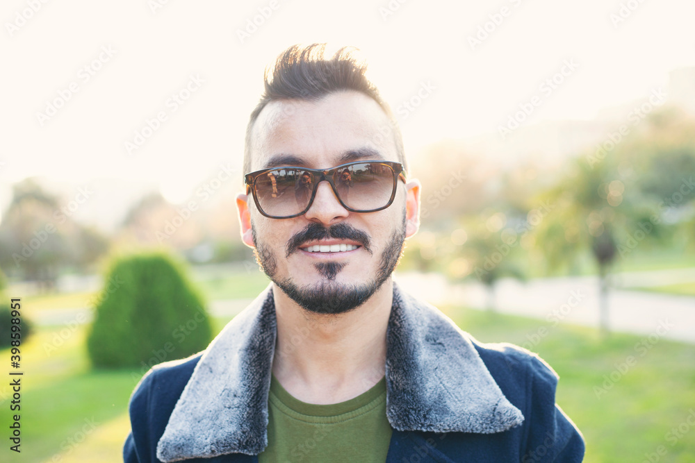 Handsome young man portrait in outdoors. Handsome young man portrait in outdoors.