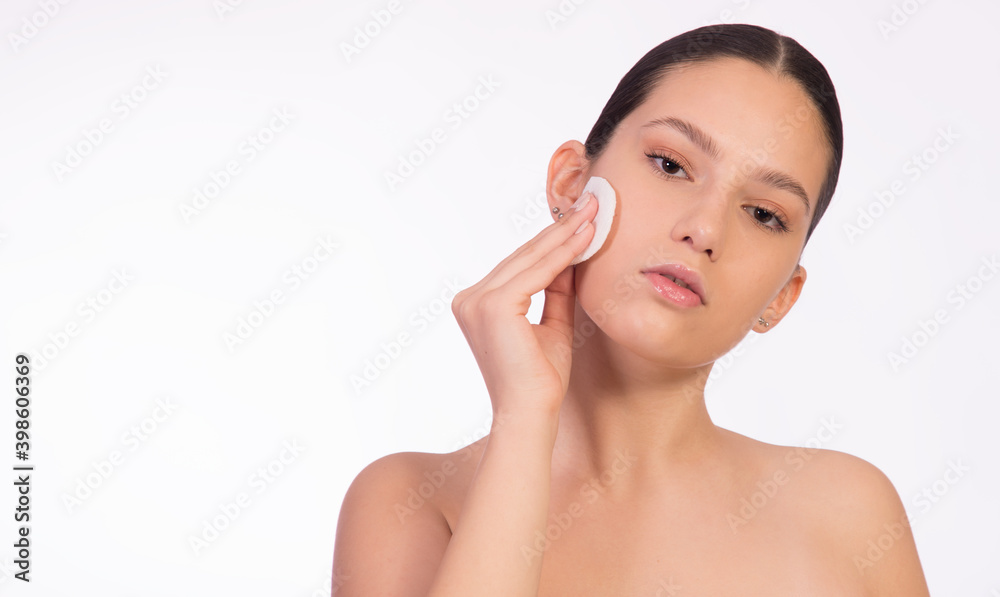 Girl with cosmetic pad , cleaning sink and removing make up, isolated on white, with copy space Girl with cosmetic pad , cleaning sink and removing make up, isolated on white, with copy space