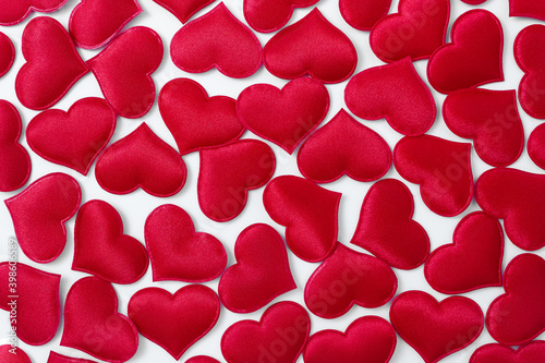 Festive background from red decorative hearts. Valentine's Day concept.