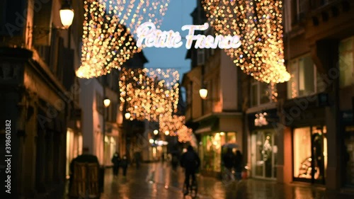 Defocused view of pedestrian street with Petite France inscription and Christmas Decorations in central Strasbourg on a Black Friday - partial lockdown therfore fewer customers photo