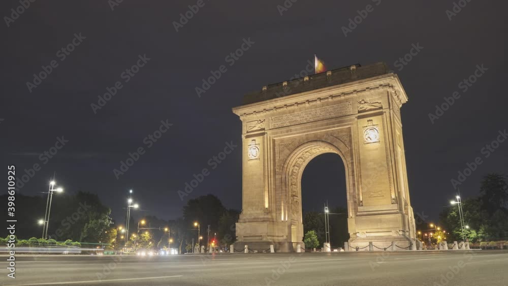 Timelapse of Arch of Triumph in Bucharest, Romania, at night, with car trail lights, a famous touristic landmark. Tourism, transportation, light trails, speed, capital city. Timelapse of Arch of Triumph in Bucharest, Romania, at night, with car trail lights, a famous touristic landmark. Tourism, transportation, light trails, speed, capital city.