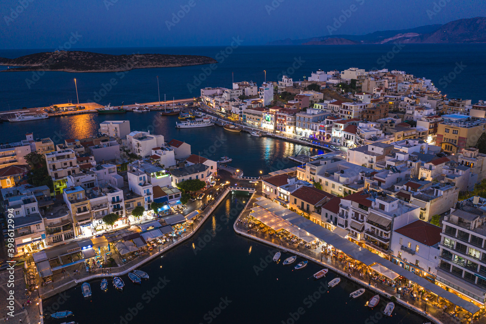 Night twilight panoramic view of Agios Nikolaos, Crete island, Greece