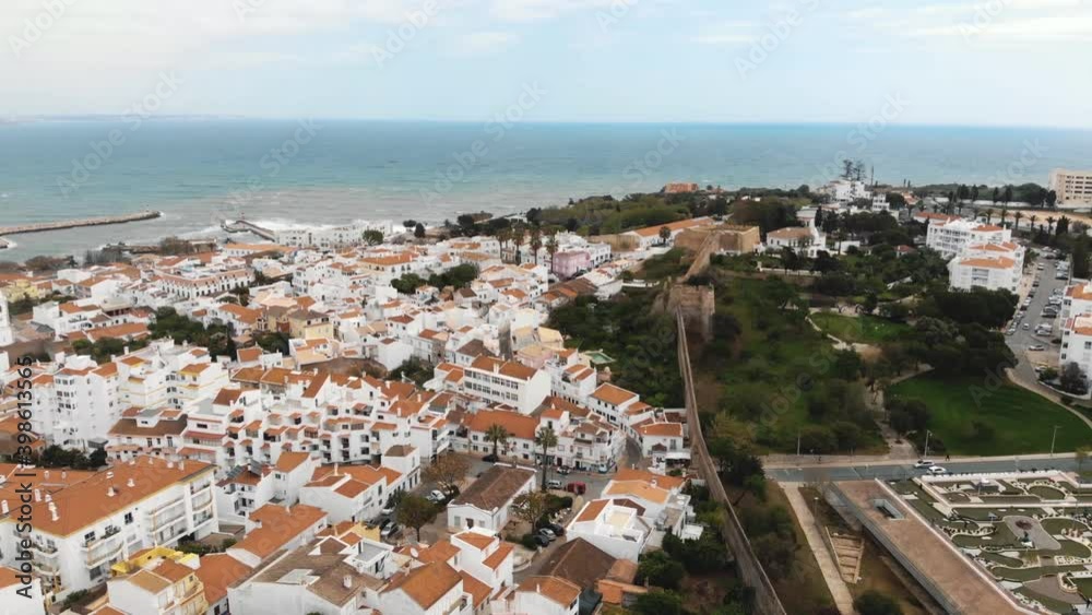Panoramic view of Lagos old town and Medieval City Walls to Atlantic coast - Aerial Orbit shot Panoramic view of Lagos old town and Medieval City Walls to Atlantic coast - Aerial Orbit shot