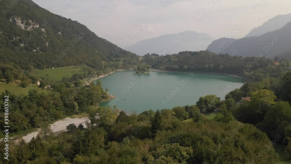 Aerial view: drone shot reveals Tenno lake, Trentino, North Italy. Green landscape during a sunny day. 4k Aerial view: drone shot reveals Tenno lake, Trentino, North Italy. Green landscape during a sunny day. 4k