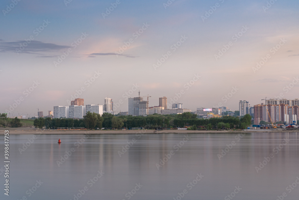 Evening city landscape, view of Novosibirsk by the Ob river