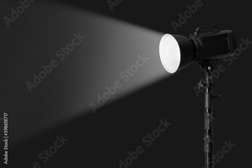 Modern lighting equipment for photo studio on dark background © Pixel-Shot