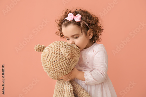 Cute baby girl with teddy b...
