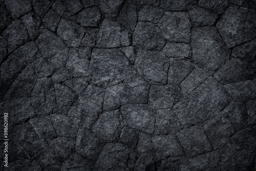 Black slate sotne wall or Dark stone texture abstract background