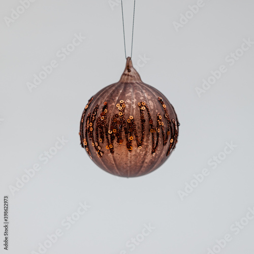 Bronze Christmas tree ball covered with zigzag ornaments and tiny beads photo