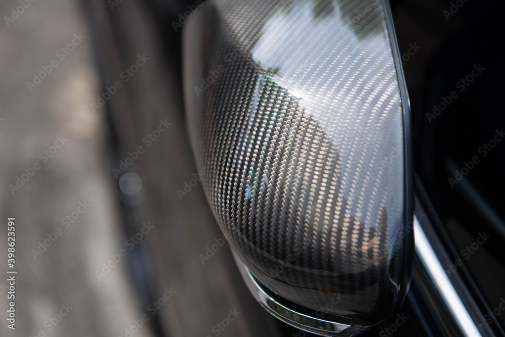 Close up of car side mirror from the carbon fibre Close up of car side mirror from the carbon fibre
