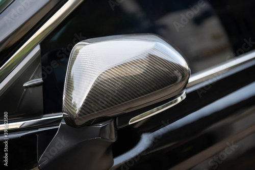Close up of car side mirror from the carbon fibre