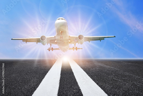 Transportation industry challenge concept and airplane business travel planning idea. Passenger or commercial plane ready for taking off or landing on runway with marking line