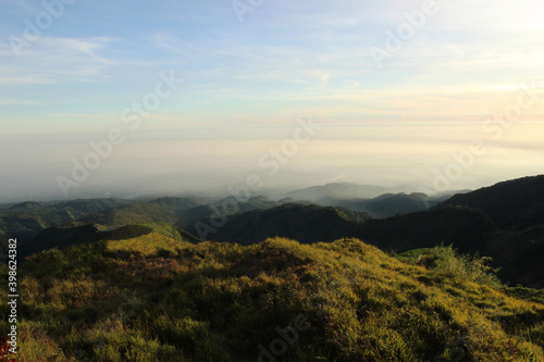 beautiful landscape nature background on hill peak with blue sky