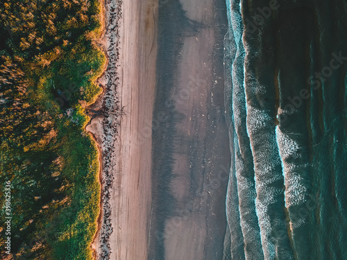 aerial of a sandy beach at sunset in newfoundland, canada