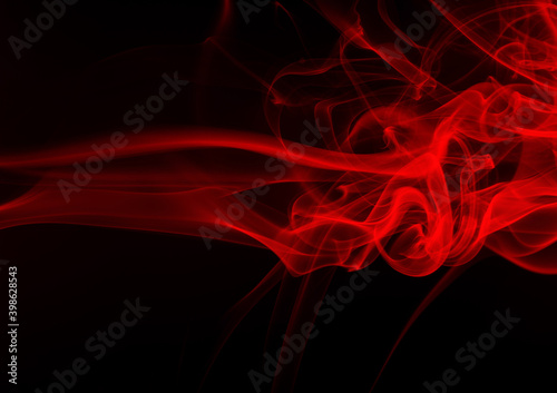 Movement of red smoke abstract on black for background