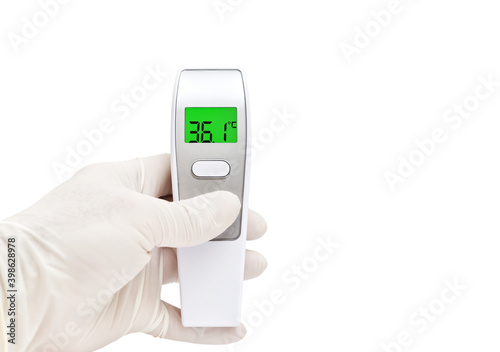 Digital thermometer for measuring body temperature display 36.1 degrees celsius. Thermometer in hand isolated on a white background. Coronavirus outbreak around the world.