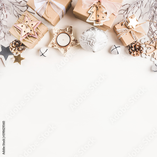 Festive Christmas background with different size gift boxes and Christmas decorations. Top view. Banner with copy space for text.
