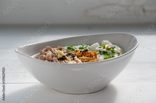 Thai style clear soup rice noodle in traditional bowl. Selective focus