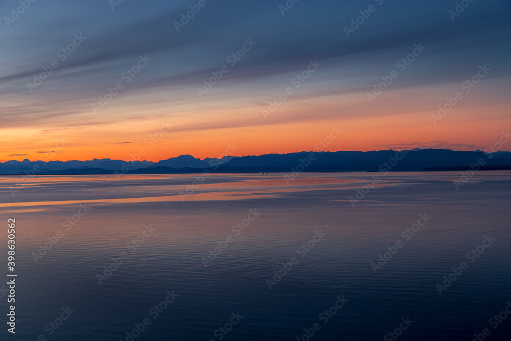 Ferry crossing at sunset travel or tourism image- British Columbia, Canada