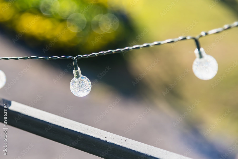 Fototapeta premium Decorative light bulbs outdoors. Party and illumination concept