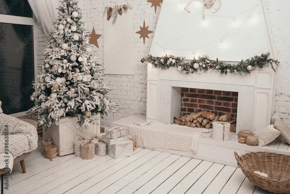 Beautiful Scandinavian new year's interior. Christmas tree near the fireplace. Gifts under the Christmas tree Beautiful Scandinavian new year's interior. Christmas tree near the fireplace. Gifts under the Christmas tree