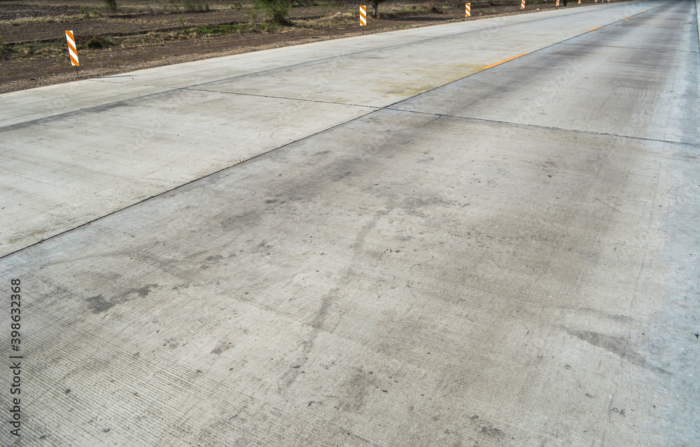 Concrete pavement road with longitudinal joint and construction joint.Empty concrete road.
