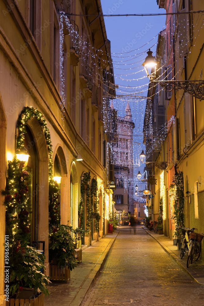 View on lanes with Christmas illumination in night Parma of Italy outdoors.