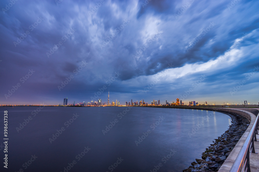Skyline panorama of Dubai with dark clouds