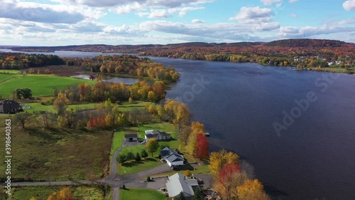 waterfront home in the nice fall colours and mountains photo