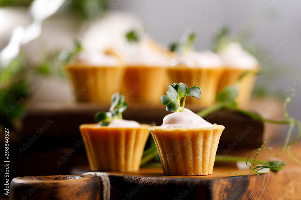Canapes with light cream filling. Still life with microgreens. The concept of an appetizing snack. Canapes with light cream filling. Still life with microgreens. The concept of an appetizing snack.