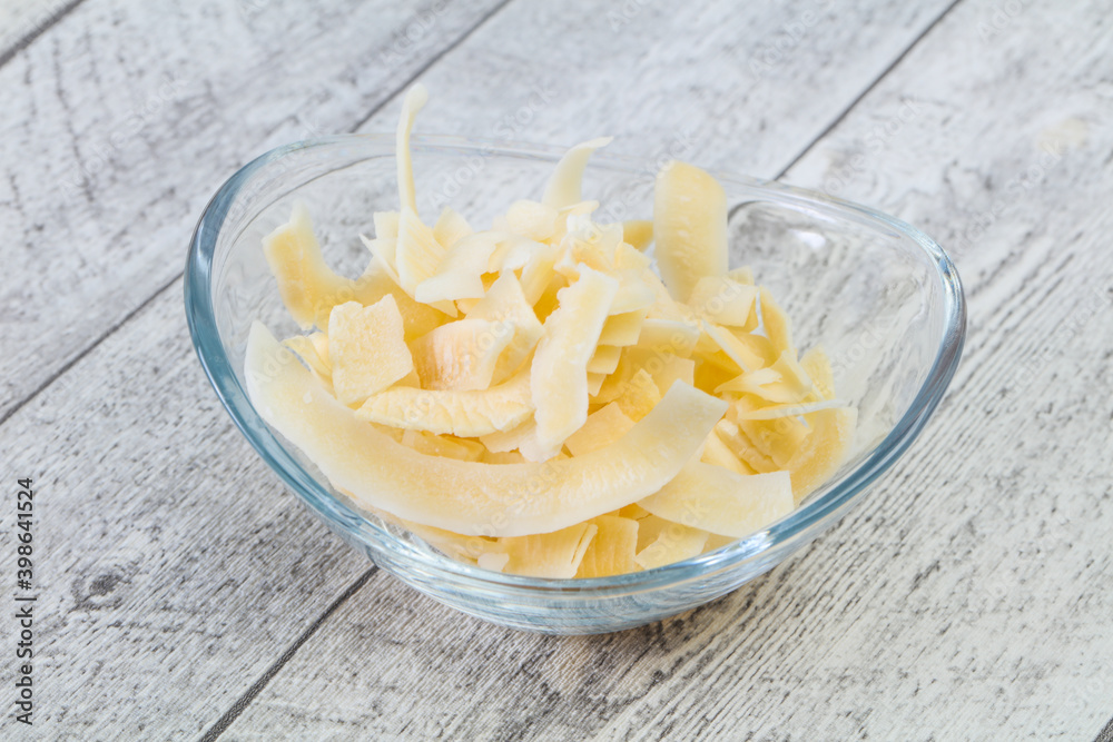 Coconut dry chips in the bowl Coconut dry chips in the bowl