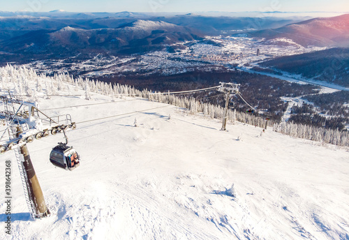 Sheregesh ski lift resort in winter, landscape on mountain and hotels, aerial top view Kemerovo region Russia