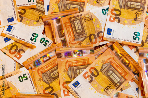 A close-up shot of a heap of 50 (fifty) euro banknotes: background