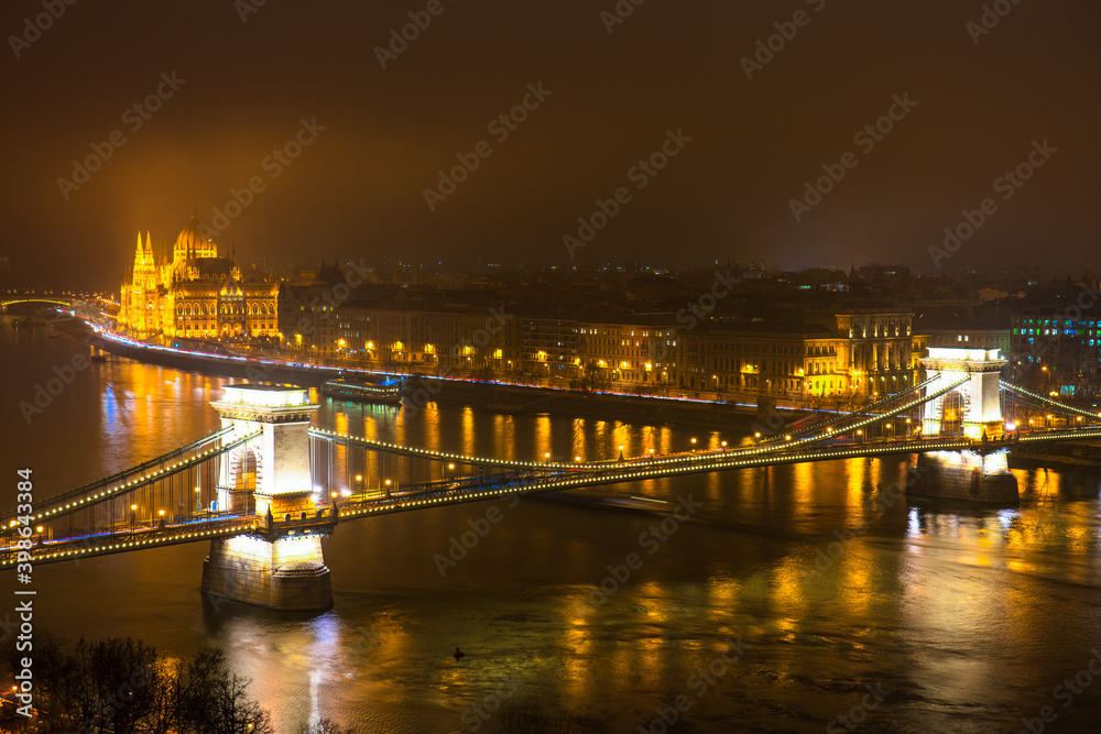 Panorama of Budapest at night overlooking Chain bridge and Hungarian parliament